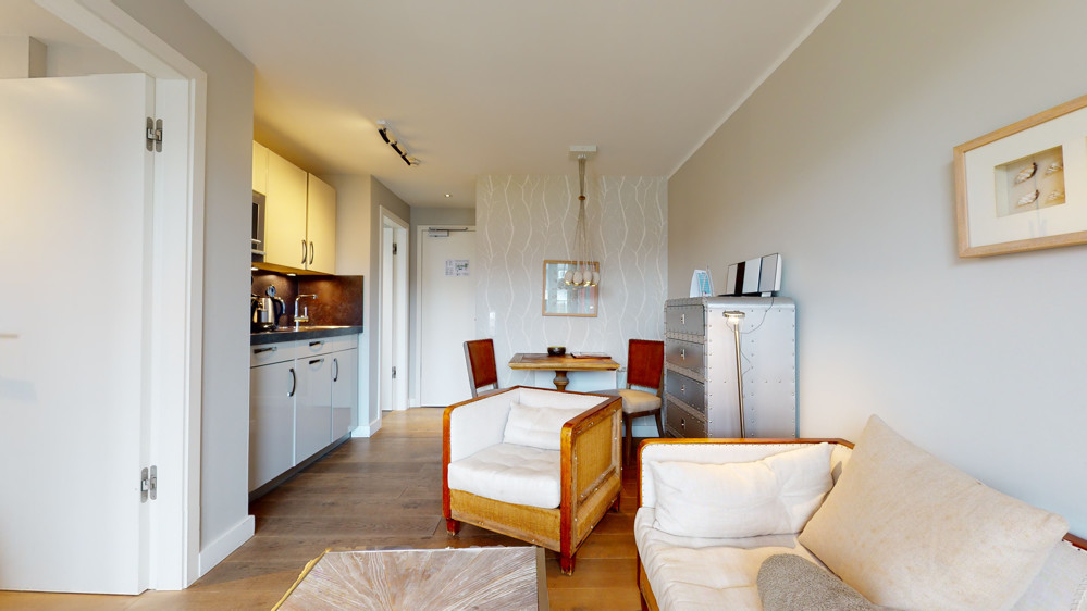 Einzigartiges Penthouse mit Leuchtturmblick und planbarer Rendite - Wohnzimmer