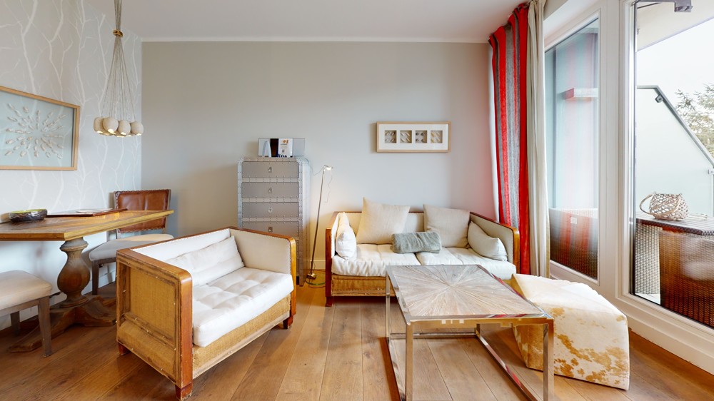 Einzigartiges Penthouse mit Leuchtturmblick und planbarer Rendite - Wohnzimmer