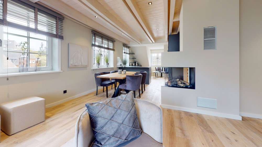 Urlaubsfeeling im Alltag: Luxuriöse Neubauwohnung in Hörnum - Wohnzimmer mit Kamin