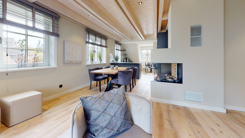 Urlaubsfeeling im Alltag: Luxuriöse Neubauwohnung in Hörnum - Wohnzimmer mit Kamin
