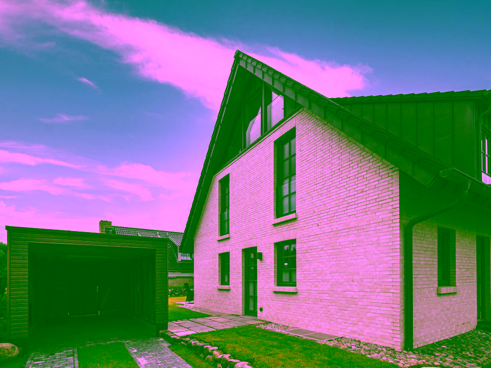 Strandnah, exklusiv und großzügig – Neubauhaushälfte in ruhiger Lage von Rantum - Carport