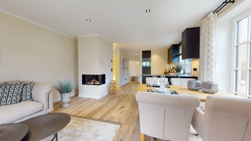 Außergewöhnliche und große Erdgeschosswohnung mit Garten im Herzen von Hörnum - Wohnzimmer