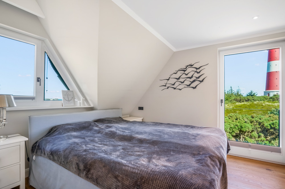 Wahrzeichen im Blick – Stilvolles Wohnen mit Nordseepanorama - Schlafzimmer