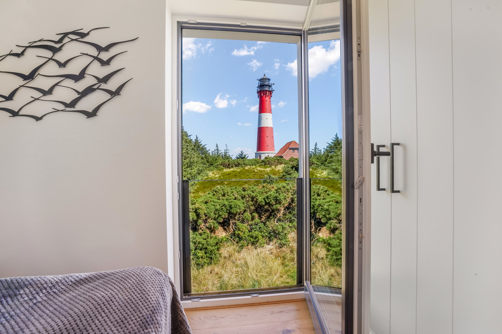 Wahrzeichen im Blick – Stilvolles Wohnen mit Nordseepanorama - Schlafzimmer