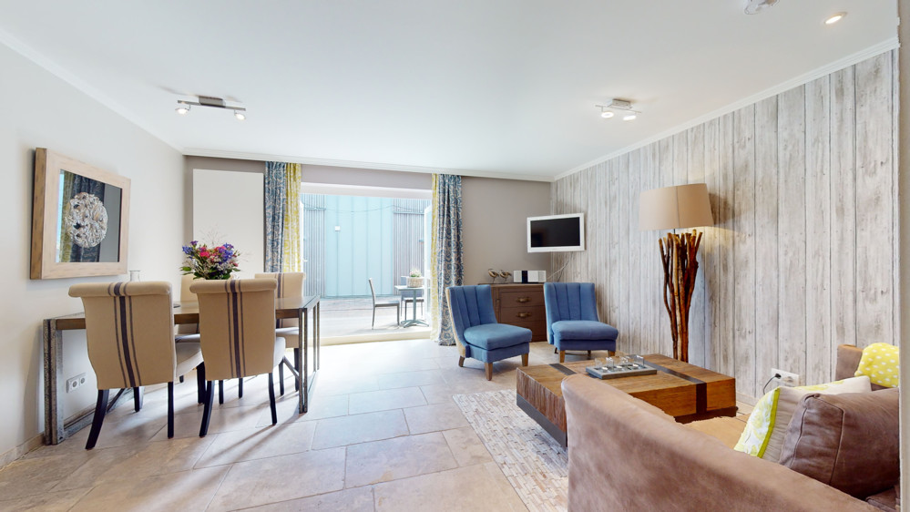 Hochwertige Kapitalanlage in exklusiver Lage im Aparthotel am Leuchtturm - Wohnzimmer