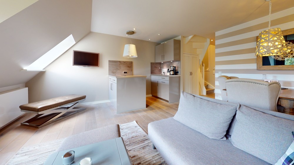 Hochwertige Kapitalanlage in exklusiver Lage im Aparthotel am Leuchtturm - Wohnzimmer