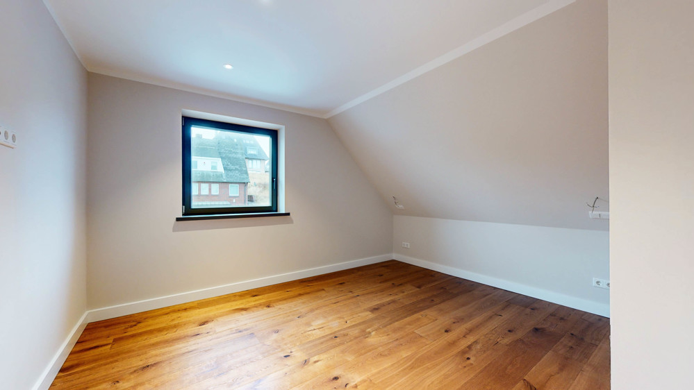 Hochwertige Neubauwohnung in strandnaher Lage mit Südbalkon - Schlafzimmer