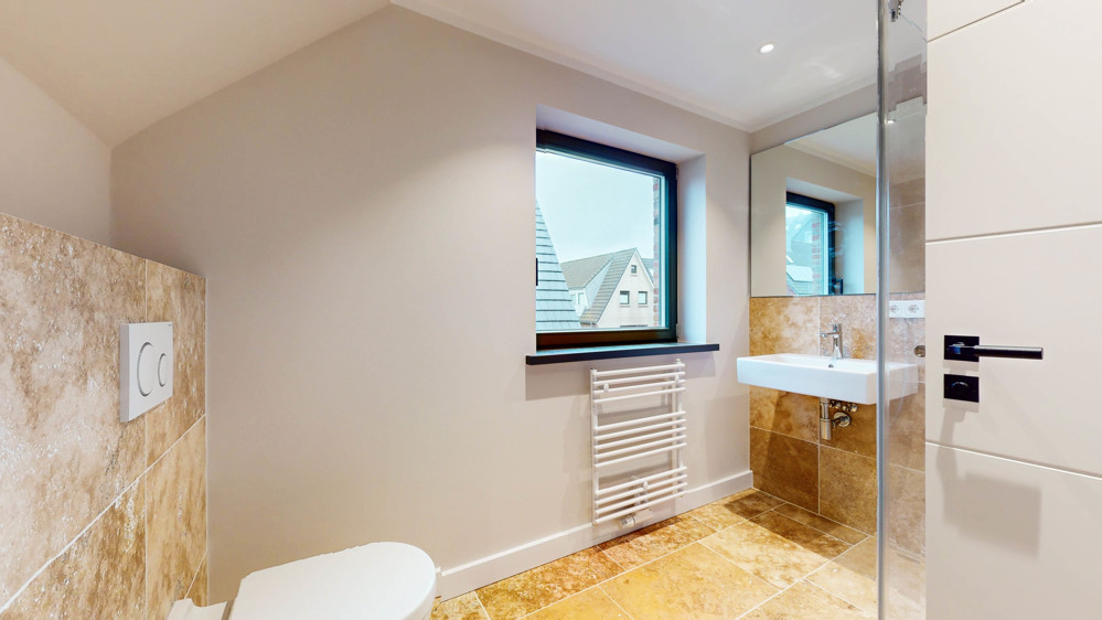 Hochwertige Neubauwohnung in strandnaher Lage mit Südbalkon - Badezimmer